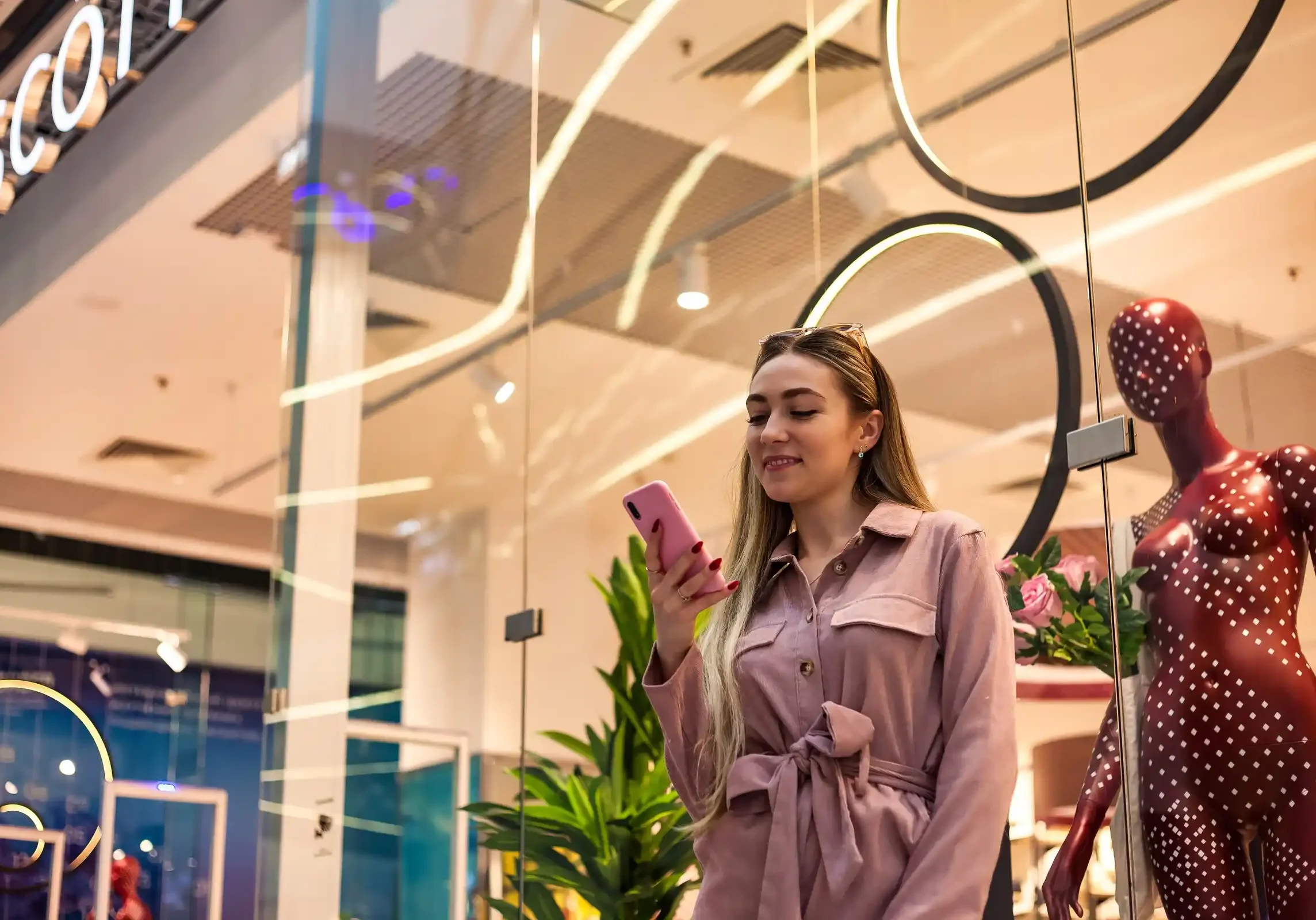 woman-with-phone-in-fashionable-store-setting